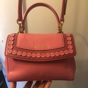 Michael Korrs pink mini bag with cross body strap